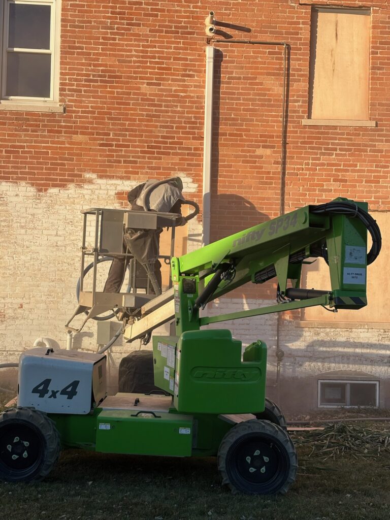 During sandblasting on old brick building During sandblasting on old brick building