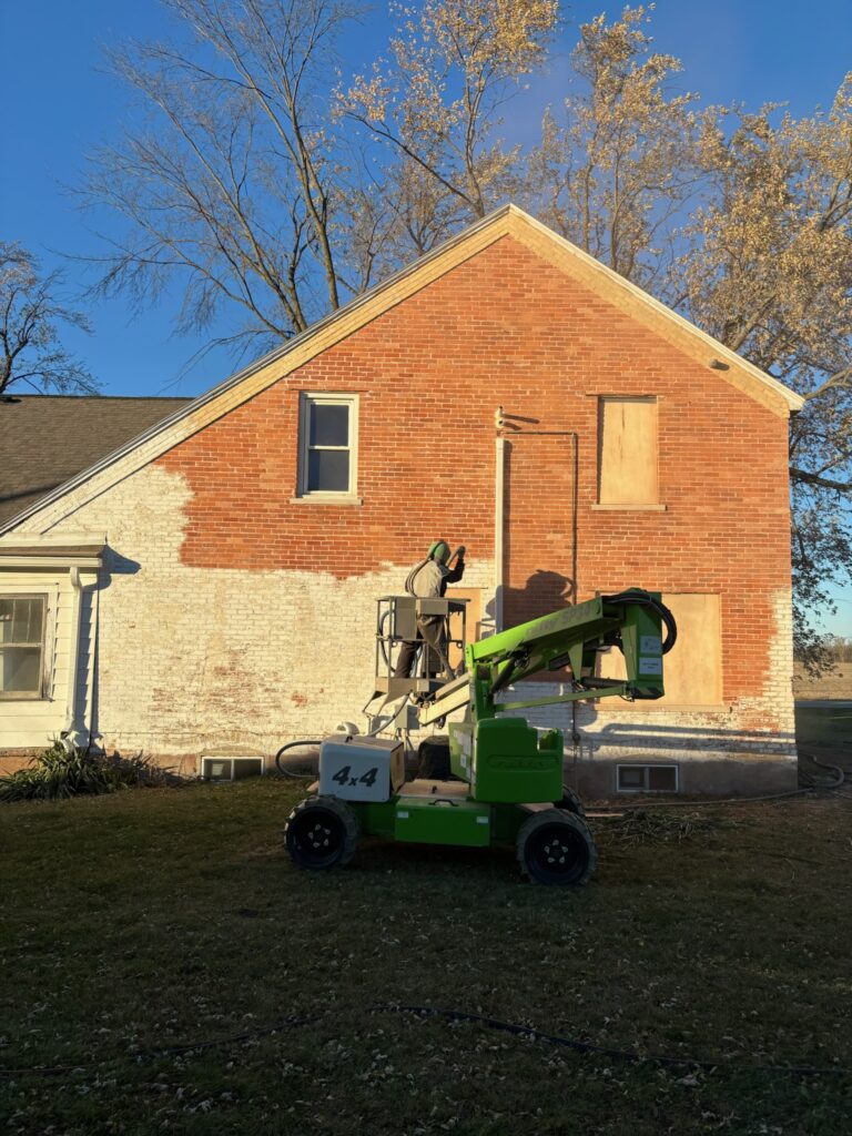 During sandblasting on old brick building During sandblasting on old brick building